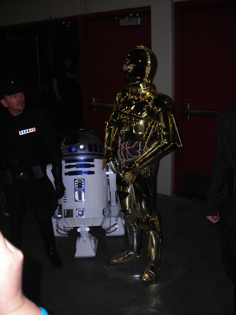 C3P0 and R2D2 and Imperial person